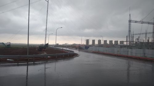 Bridge over road against sky