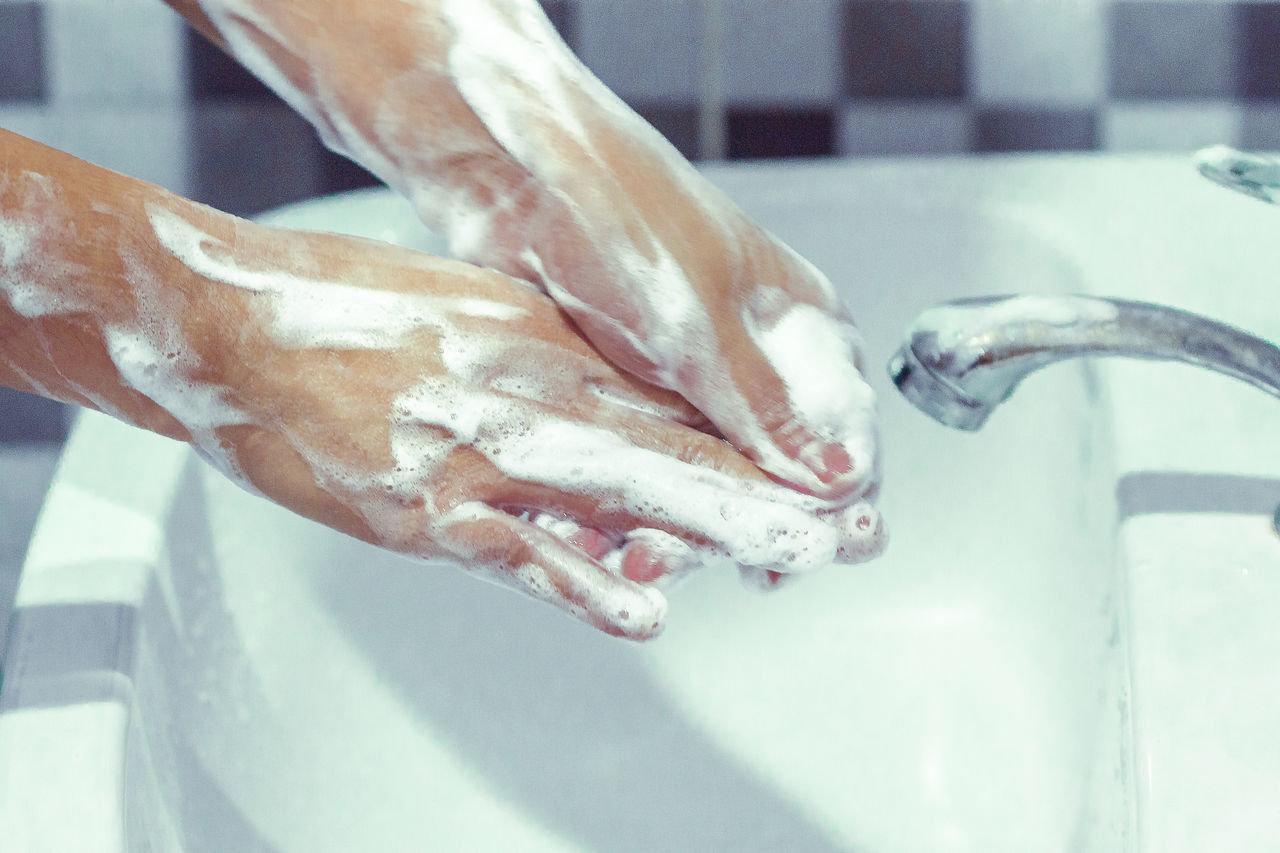 CLOSE-UP OF HAND IN WATER