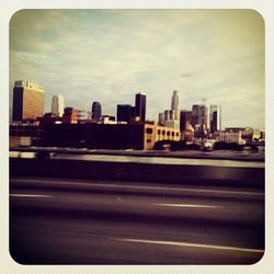 City skyline against cloudy sky