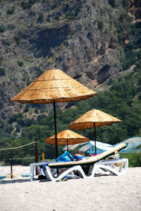 Lounge chairs and parasols on beach