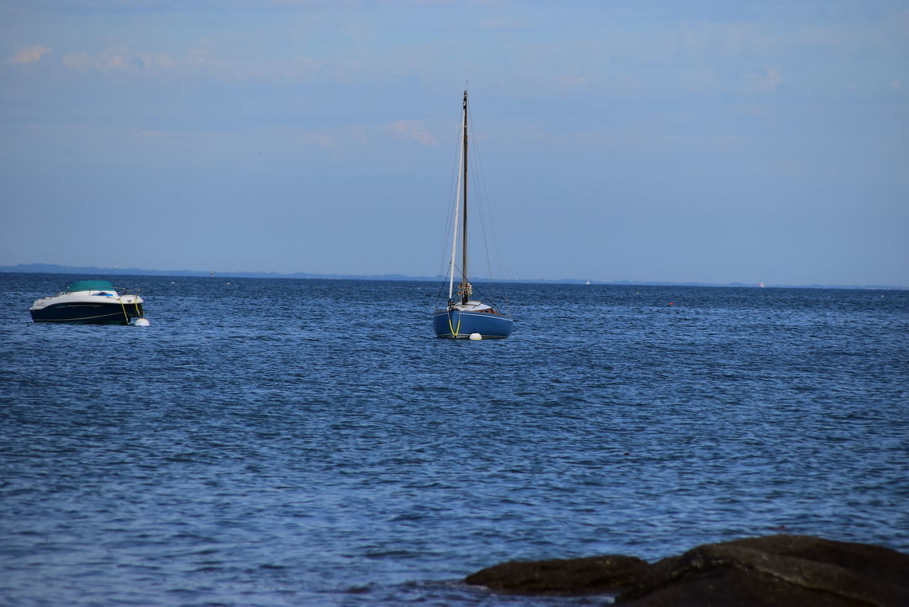 SAILBOATS SAILING IN SEA AGAINST SKY