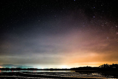 Scenic view of star field against sky at night