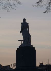 Statue against sky during sunset