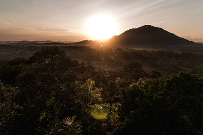 Scenic view of landscape against sky during sunset