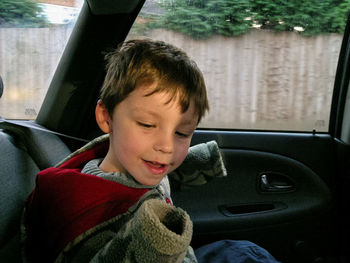 Close-up of woman sitting in car