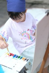 High angle view of woman holding bouquet