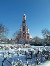 Snow on field against clear sky