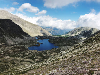 Scenic view of lake and mountains against sky