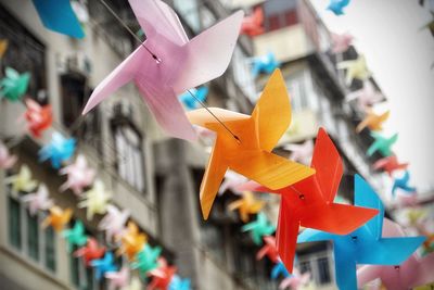 Low angle view of decoration hanging against sky 