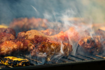 Close-up of meat on barbecue grill