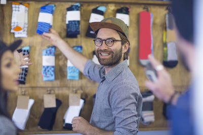 Friends in store shopping for clothes