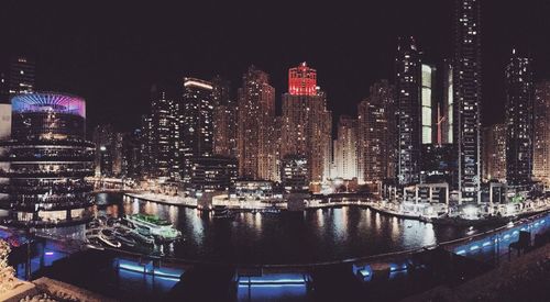 Illuminated buildings in city at night