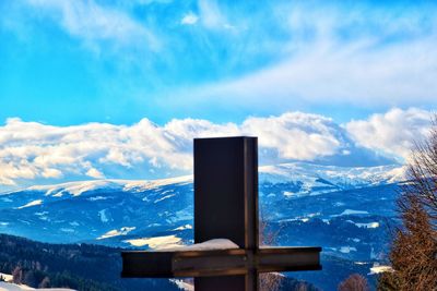 Scenic view of snowcapped mountains against blue sky