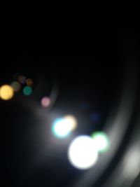 Defocused image of illuminated lights at night