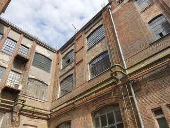 Low angle view of old building against sky