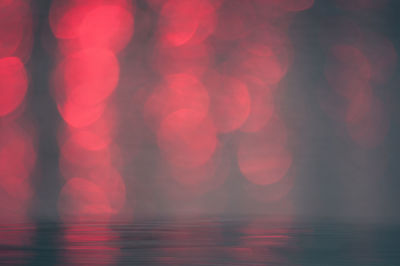 Defocused image of illuminated lights at night