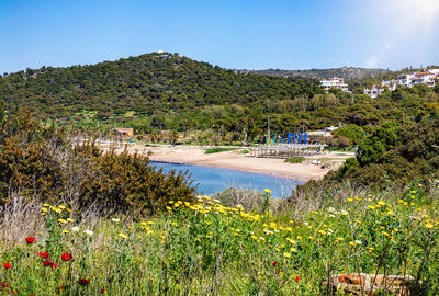 Scenic view of sea and mountains against sky