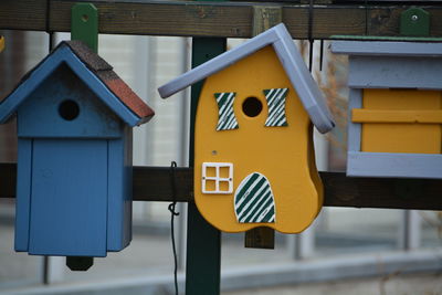 Colorful birdhouses in back yard