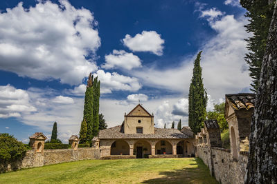 Panoramic view of temple and building against sky