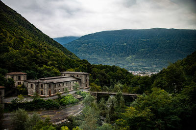 High angle view of building and mountains against sky