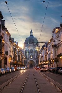 City street amidst buildings against sky