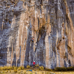 Low angle view of man on rock