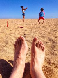 Low section of people on beach