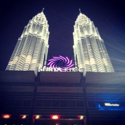 Low angle view of skyscraper at night