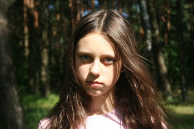 Portrait of teenage girl in forest