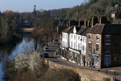 High angle view of river amidst buildings in town