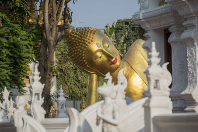 Statue against temple outside building