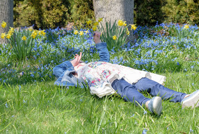 Woman lying on field