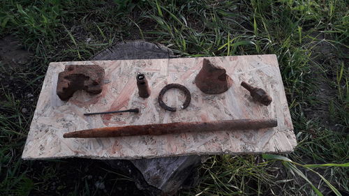 High angle view of old rusty metal on field