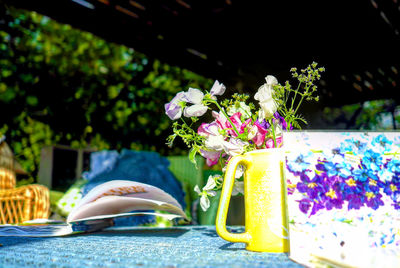 Flowers on table by swimming pool