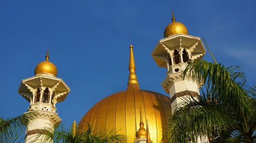 Low angle view of traditional building against blue sky