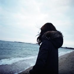 Scenic view of sea against cloudy sky