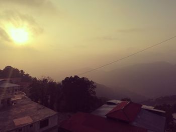 High angle view of buildings at sunset