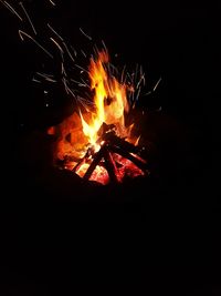 Bonfire on wooden structure at night