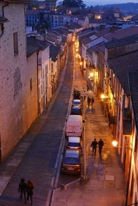 High angle view of people walking on street at night