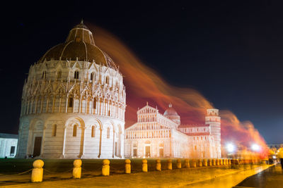 Low angle view of illuminated cathedral against sky at night