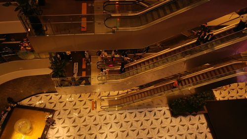High angle view of illuminated escalator in city