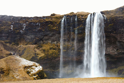 The skogafoss waterfall in winter, iceland.