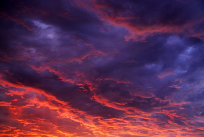 Low angle view of dramatic sky during sunset