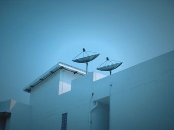 Low angle view of building against clear blue sky