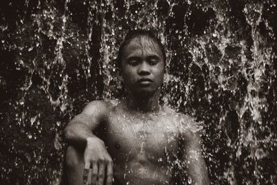 Portrait of shirtless man in water