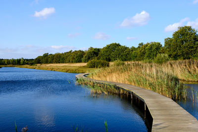 Scenic view of river against sky