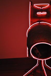 Low angle view of telephone booth against wall