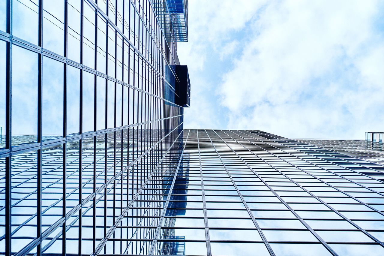 architecture, building exterior, built structure, low angle view, modern, office building, glass - material, city, tall - high, skyscraper, sky, reflection, tower, building, blue, day, pattern, cloud - sky, glass, cloud