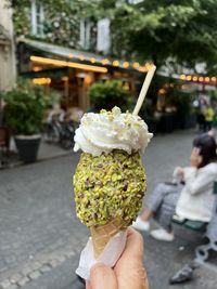 Cropped hand of person holding food