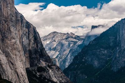 Scenic view of mountains against cloudy sky